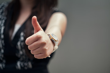 Girl with thumbs-up sign