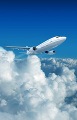 Fototapeta na wymiar Airplane and clouds