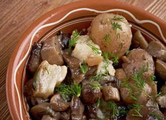 Fried mushrooms with bacon and potatoes