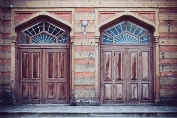 Two brown wooden doors