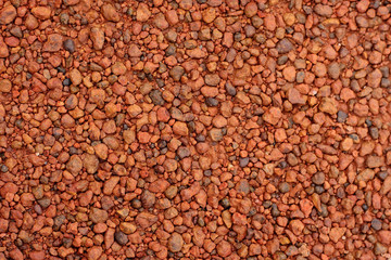 red laterite gravel for background.
