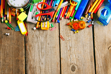 School tools. On wooden background.