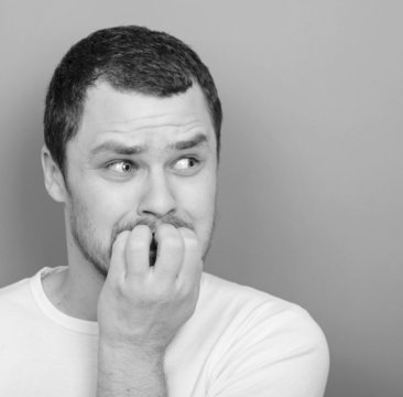 Portrait of man biting nails - Monocrome or black and white port