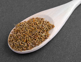 Close view of spoon filled with anise seeds