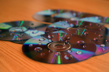Compact disks splattered by water