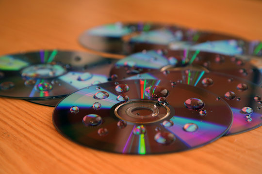 Compact disks splattered by water