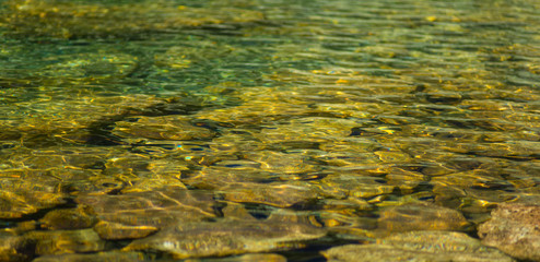 Clear mountain lake in the Alps in the summer