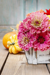 Bouquet of zinnia flowers in wooden box