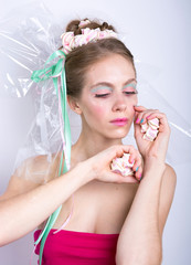 Obraz na płótnie Canvas Young woman with marshmallow makeup style beauty fantasy.