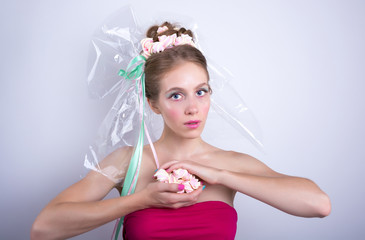 Young woman with marshmallow, makeup style beauty fantasy.