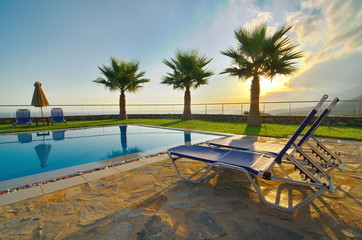 Palm Trees and Pool in an Aegean sunrise