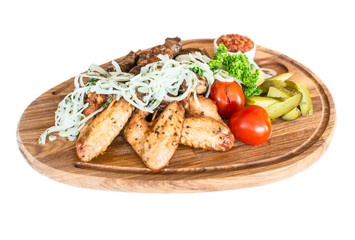 Grilled chicken wings with French fries