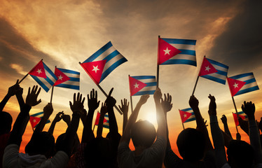 Silhouettes of People Holding Flag of Cuba
