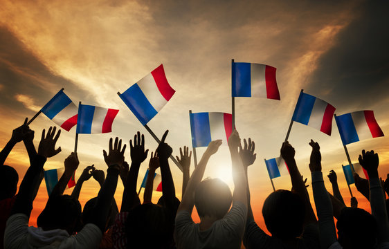 Silhouettes of People Holding the Flag of France