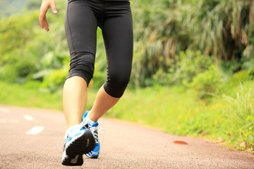 woman runner fall off by sports injury