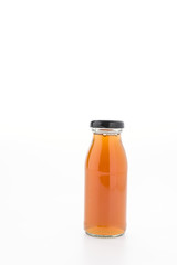 Apple juice bottle isolated on white background