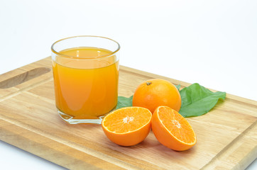 orange sliced and orange juice on chopping board background