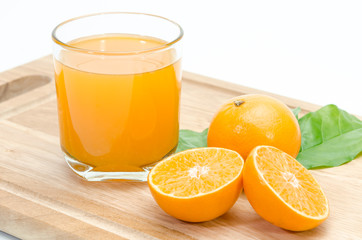 orange sliced and orange juice on chopping board background