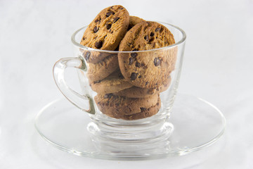 Chocolate chip cookies on a glass