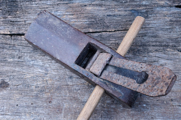old vintage carpenter plane on wood background