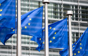 EU flags in front of Berlaymont building - obrazy, fototapety, plakaty