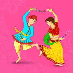 Man and woman dancing on Dandiya night
