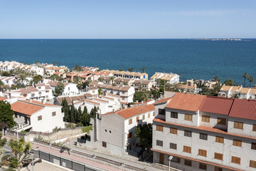 Fototapeta na wymiar Views of Santa Pola town with Tabarca islet at the background