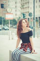 young beautiful hipster woman with red curly hair