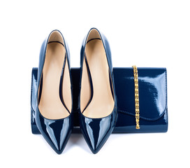 Beautiful  blue shoes with clutches on white isolated background