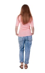 back view of standing young beautiful  redhead woman.