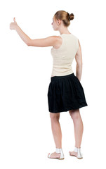 Back view of successful woman thumbs up