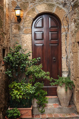 The door in the alley of the old Tuscan town, Italy