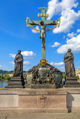 Fototapeta na wymiar Statue with Hebrew lettering in Charles Bridge, Czech Republic