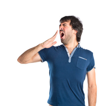 Man yawning over isolated white background