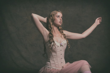 Sensual vintage ballet fashion woman wearing pink corset and dre