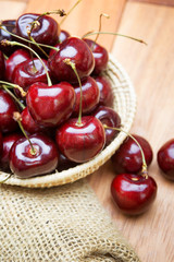 Fresh red Cherries on wooden table