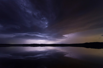 Fototapeta na wymiar Supercell thunderstorm at night with lightning