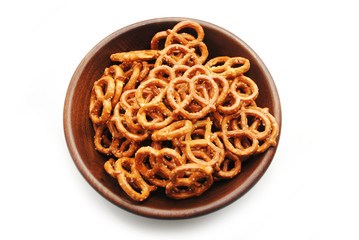 Pretzels in a Round Wooden Bowl Over White