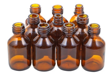 many little open brown glass pharmacy bottles