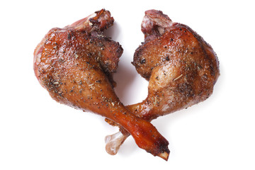 two fried duck legs isolated on white close up horizontal
