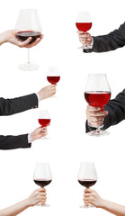 set od red wine glasses in hand