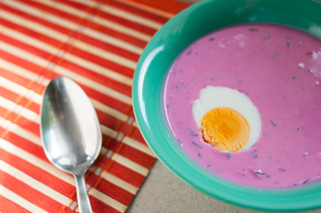 Pink cold beet soup with egg