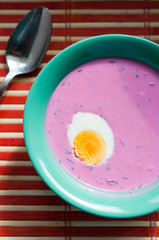 Pink cold beet soup with egg