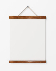 blank poster with wooden frame hanging on the white wall