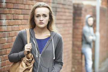 Teenage Girl Feeling Intimidated As She Walks Home - obrazy, fototapety, plakaty