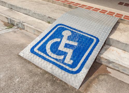 Ramped Access, Using Wheelchair Ramp With Information Sign On Fl