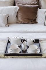 Fototapeta na wymiar tray of tea set on bed