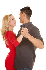 couple dancing red dress look into eyes