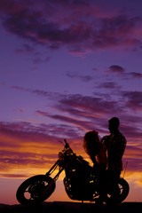 Plakat silhouette couple together on motorcycle her lean back