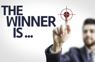 Business man pointing the text: The Winner Is...